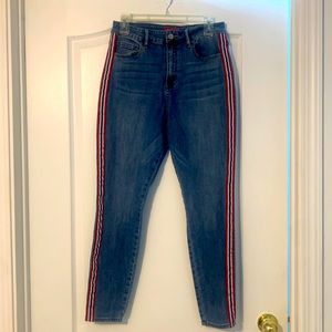 Jeans with red store and blue stripe